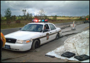 Funny Police Pics - Police car stuck in concrete